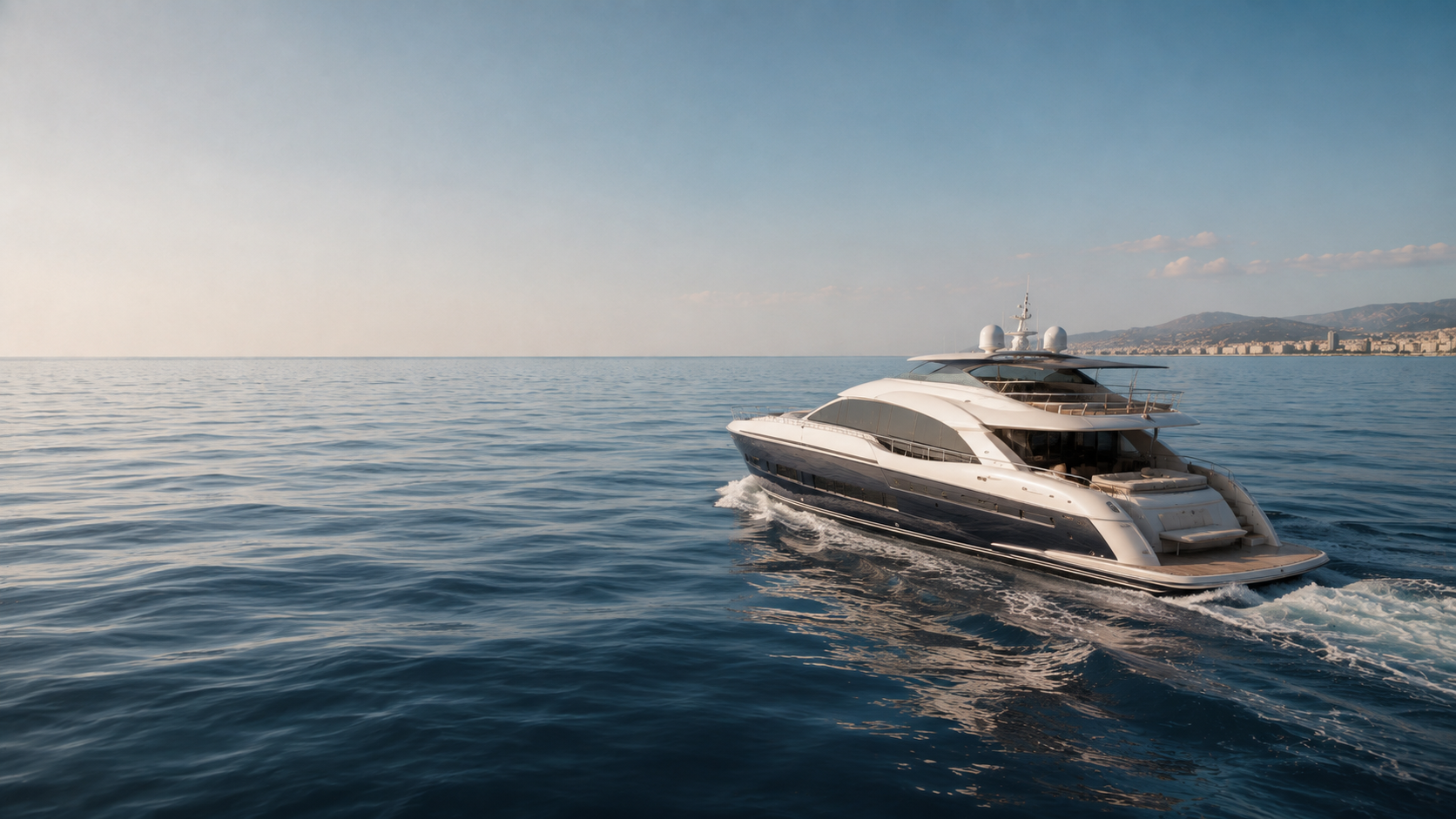 Private yacht cruising through open coastal water.